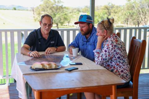 Regional Area Manager for Capricornia, John Metelli talks with QRIDA clients Matt and Kristie Lisle.